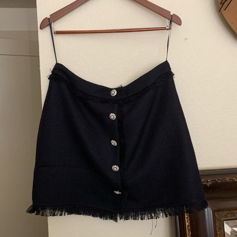 Never worn navy blue skirt with buttons and fringe